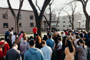 a dozen students on the Mission University Campus